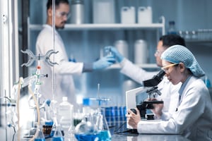 Health care researchers working in lab